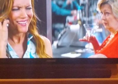 As "Woman in Restroon" with Leslie Mann